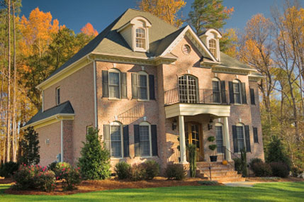 pink brick house and trees